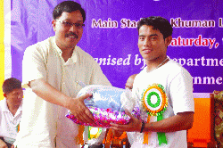 MLA Kh Ratankumar awarding Nanao (Sobhapati Samom)