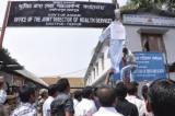 An effigy of Health & Education Minister Dr Himanta Sarmah being hung
