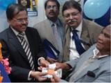 The Managing Director of Indian Overseas Bank Mr. M. Narendra along with a client at the bank's new ATM at Shillong