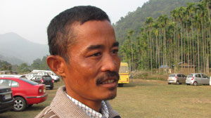 Hemanta Rabha, busy in collecting tax from the picnic groups visiting the forest. 