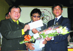 T.Kharpran being feliciated by Mr.P.Lyngdoh,MLA and D.Syiemlieh G.S,MSOA
