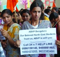 A women holding pluck with ABVP Bengaluru message for trusting them.